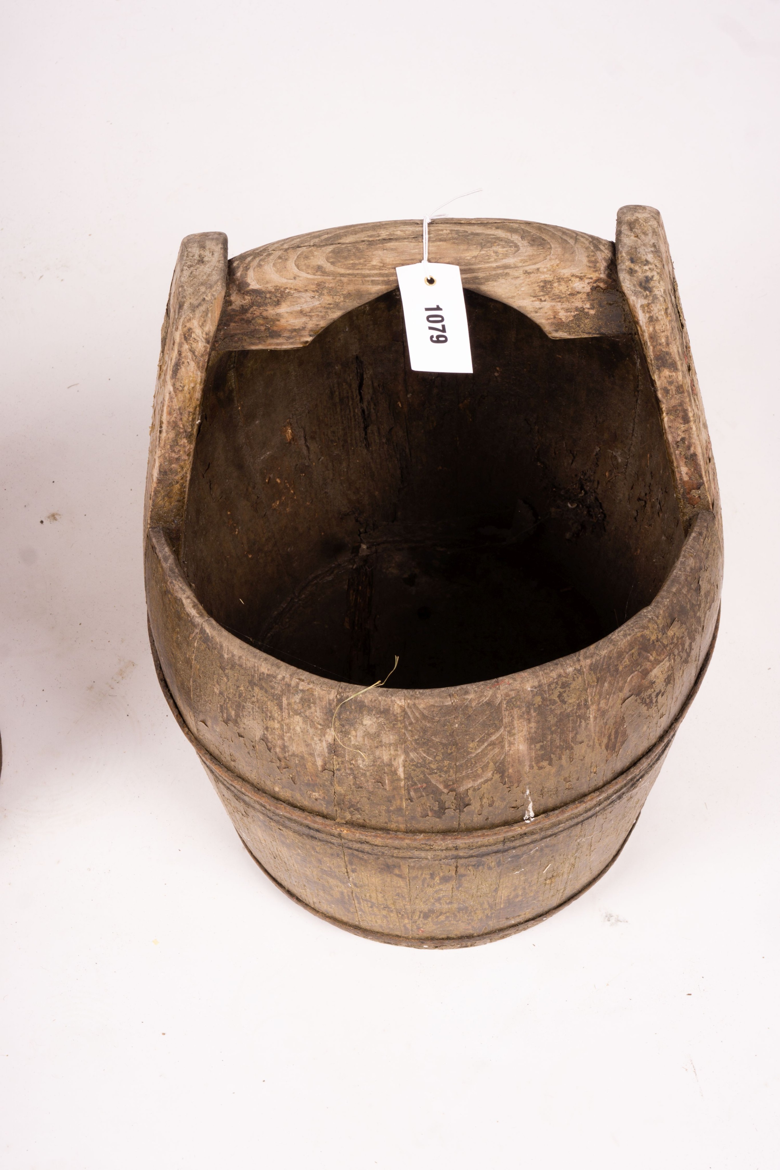 A Chinese staved wood rice carrier together with a circular iron bound staved wood bucket, larger 35cm diameter, height 52cm